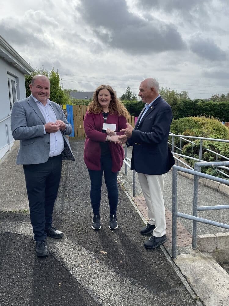 Billy Higgins presenting a check at Ballaghderg Pre-School in Letterkenny, Donegal